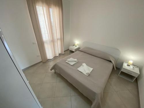 A bed or beds in a room at Appartamento Carlo Alberto