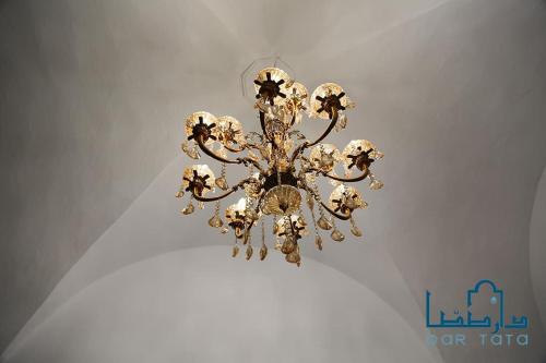 a chandelier hanging from a ceiling in a room at Dar Tata in Nabeul