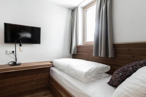 Кровать или кровати в номере Aktiv- und Wellnesshotel Traube- Post