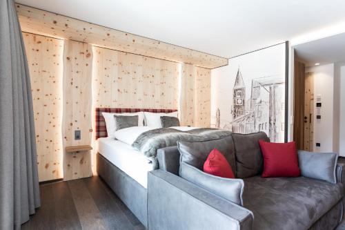 Кровать или кровати в номере Aktiv- und Wellnesshotel Traube- Post
