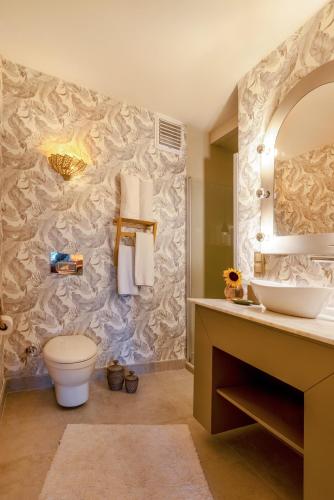 a bathroom with a toilet and a sink at La Capria Suite Hotel Alacati in Alacati