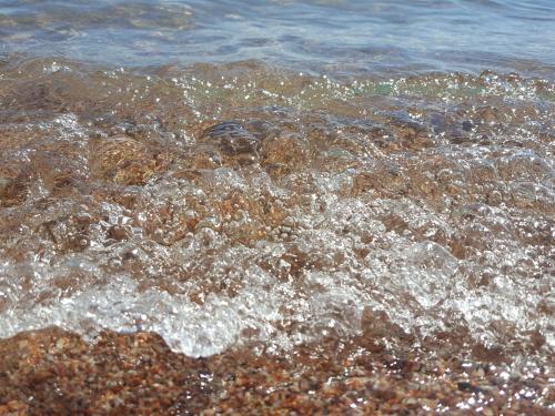 a close up of the water on the beach at Квартира в Радуга WEST in Koshkolʼ
