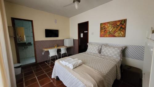 Giường trong phòng chung tại Lar de Nanci e Beto