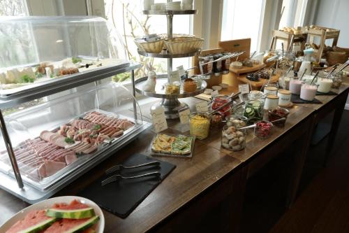 a buffet with meats and other food on a table at Lieblingsplatz Bohlendorf Rügen in Wiek auf Rügen 