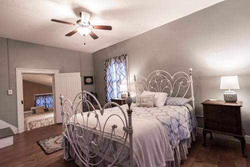 a bedroom with a bed and a ceiling fan at Armory Quarters B in Harpers Ferry