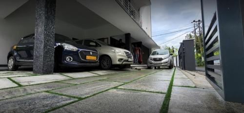 a group of cars parked in a parking lot at Bachan's Casa in Cherai Beach