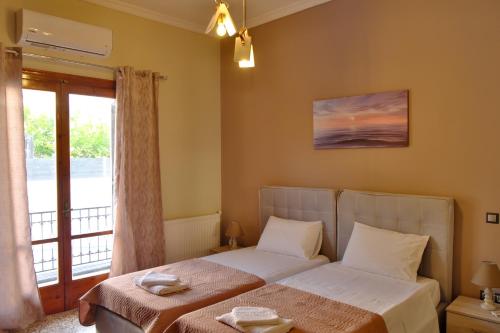 Ένα ή περισσότερα κρεβάτια σε δωμάτιο στο Giovana's pool house