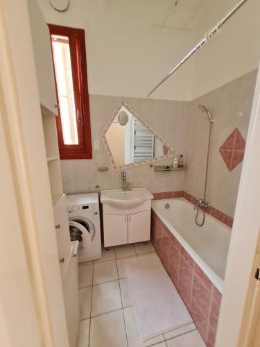 a bathroom with a tub and a sink and a toilet at Marble Apartment -near Buda castle in Budapest