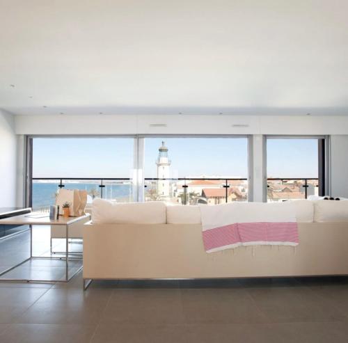 Posezení v ubytování Le Phare du Grau Superbe Appartement Standing 3 chambres vue Mer