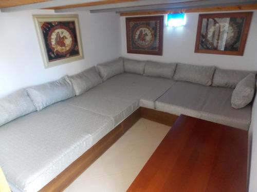 a large couch in a living room at Olympia Hotel in Sarandë
