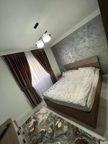 מיטה או מיטות בחדר ב-Borșa ApartHotel 4