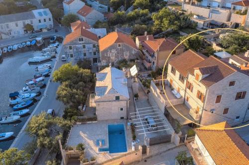 an aerial view of a town with a harbor at 4 bedrooms seafront Villa LAURUS with heated pool for up to 8 people in Sumartin
