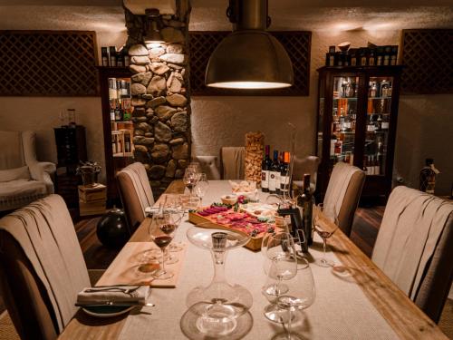a table with wine glasses on it in a restaurant at La Villa Del Re - Adults Only - Small Luxury Hotels of the World in Castiadas