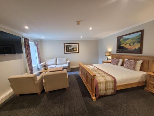 A bed or beds in a room at Stone House Hotel ‘A Bespoke Hotel’