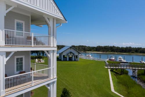 an aerial view of a house with a yard and a dock at Beaufort Hotel in Beaufort