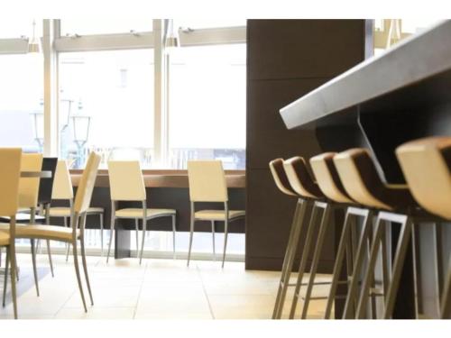 a dining room with a table and chairs at R&B HOTEL HACHIOJI - Vacation STAY 38830v in Hachioji