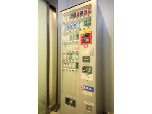a vending machine in a room with drinks at R&B HOTEL HACHIOJI - Vacation STAY 38827v in Hachioji