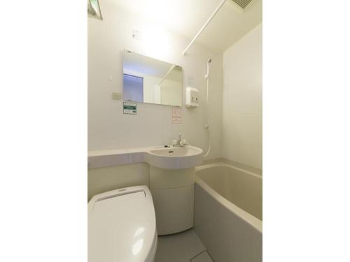 a bathroom with a toilet and a sink and a tub at R&B HOTEL NAGOYA SAKAE HIGASHI - Vacation STAY 40507v in Nagoya