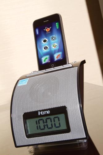 an alarm clock with a phone on top of it at Ayres Hotel Laguna Woods - Aliso Viejo in Laguna Woods