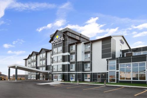 a rendering of the front of a hotel at Microtel Inn & Suites by Wyndham Estevan in Estevan
