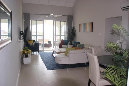 a living room with a couch and a table at Cozy Getaway in Priory