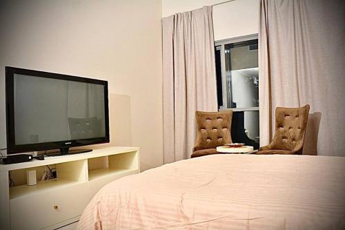 Säng eller sängar i ett rum på Cosy Studio in Marina