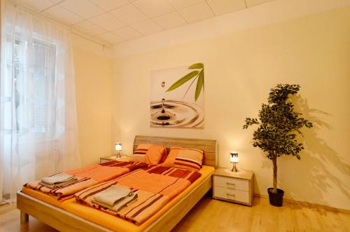 a bedroom with a bed and a potted plant at Haus Gaaden in Gaaden