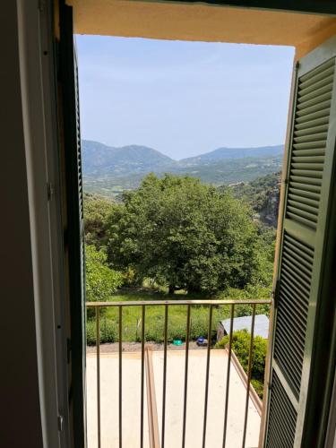 a view from a window of a balcony at Castagnu in Santo-Pietro-di-Tenda