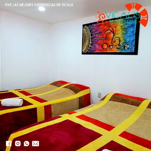 Ліжко або ліжка в номері Hotel Vicalis & Restaurante