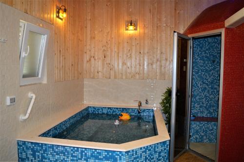 a bathroom with a tub with a toy in it at Studio Apartments Luka Biograd - Benkovac in Benkovac