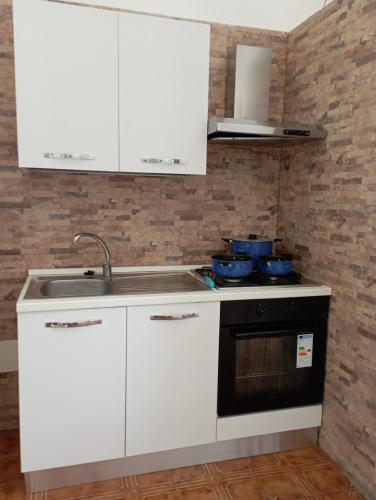 Kuchyň nebo kuchyňský kout v ubytování Casa bluchic Gioisia