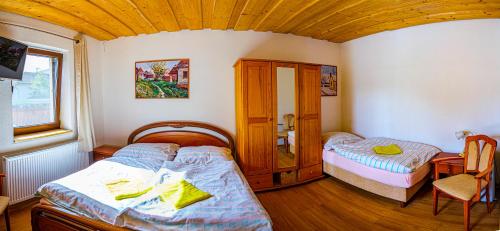a bedroom with two beds and a window at SIKY-LIPTOV in Liptovský Ján