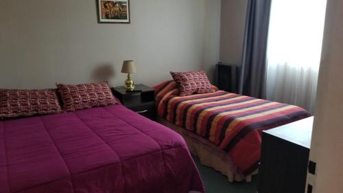 Ein Bett oder Betten in einem Zimmer der Unterkunft My House in El Calafate