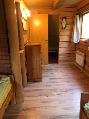 a room in a cabin with a wooden floor at Villa Hideaway in Pärnu