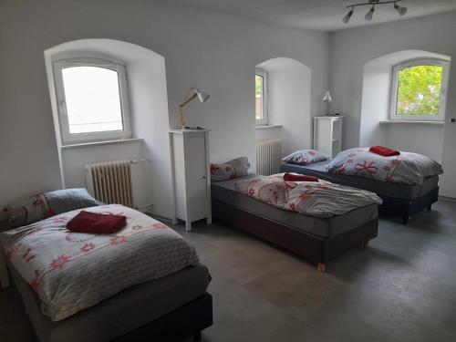 Ένα ή περισσότερα κρεβάτια σε δωμάτιο στο Haus Guttenberg