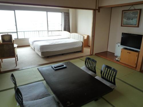 Ένα ή περισσότερα κρεβάτια σε δωμάτιο στο Kaiyoukaku