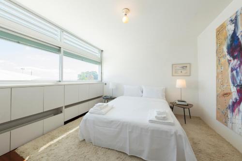 A bed or beds in a room at Casa da Ria