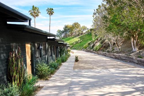 a sidewalk next to a building with a cactus at Hotel June Malibu in Malibu