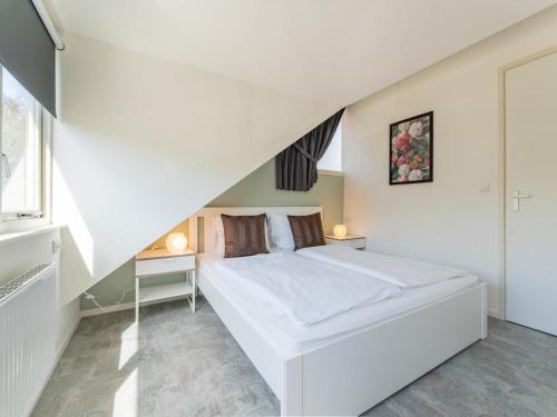 Postel nebo postele na pokoji v ubytování Tiny house Pimpelmees