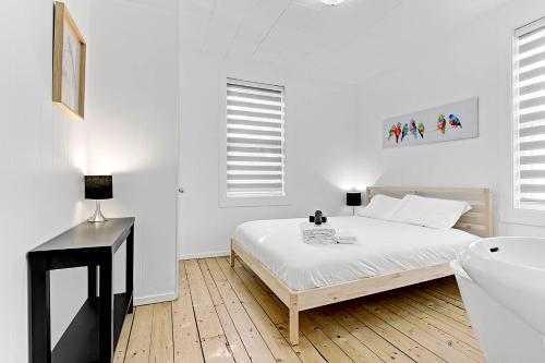 Кровать или кровати в номере Les Appartements du 790