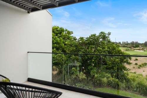 a view from the balcony of a house at Pullman Magenta Shores Resort in The Entrance
