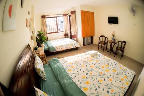 Postel nebo postele na pokoji v ubytování Hệ thống MylaHome - Chi nhánh Ks Kim Châu