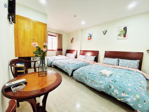 Postel nebo postele na pokoji v ubytování Hệ thống MylaHome - Chi nhánh Ks Kim Châu