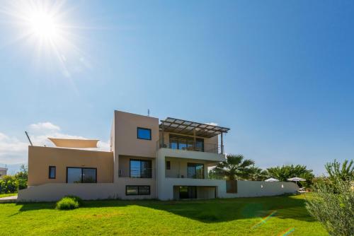 a villa with a view of the house at Xenos Villa 2 With 5 Bedrooms private swimming pool, near the sea in Tigaki
