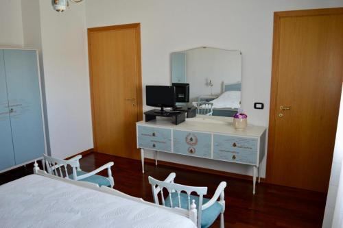 Ένα ή περισσότερα κρεβάτια σε δωμάτιο στο B&B La Chiocciola