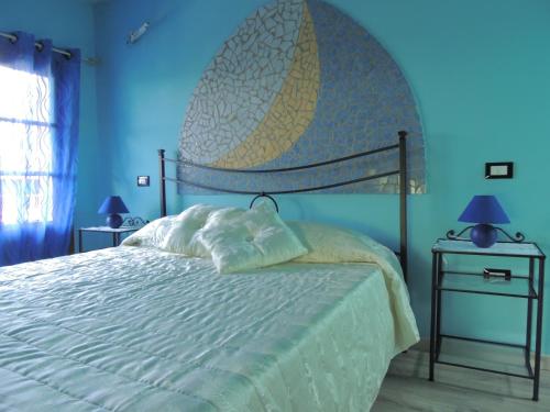 A bed or beds in a room at Il Cipresso del Gallo