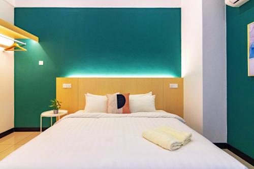 Ένα ή περισσότερα κρεβάτια σε δωμάτιο στο Scott Signature Suites by ALV