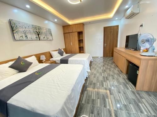 Una cama o camas en una habitación de An Cường Hotel