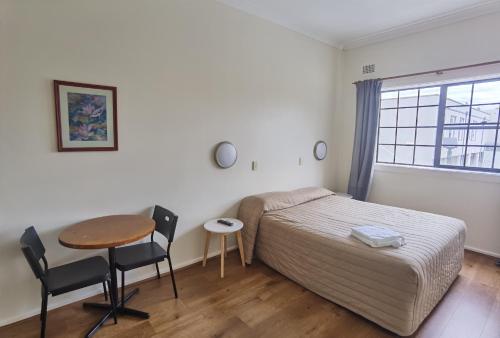 Ένα ή περισσότερα κρεβάτια σε δωμάτιο στο Watersedge Motel