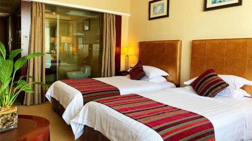 Cama o camas de una habitación en Maison New Century Hotel Ningbo